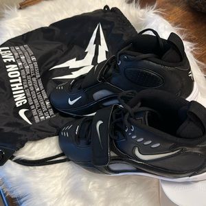 Men’s size 13 Nike Football cleats.  Black and white with carry bag.  New
